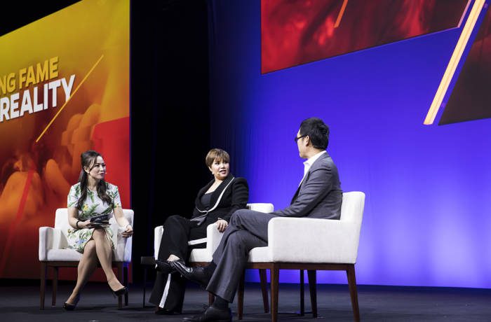 Panel discussion held by YPO with speakers sitting on stage