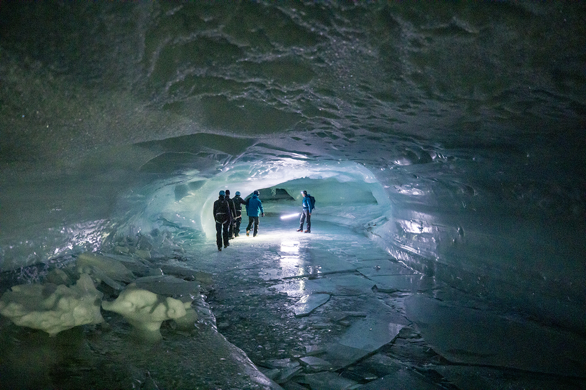 Team of adventurers in an ice tunnel
