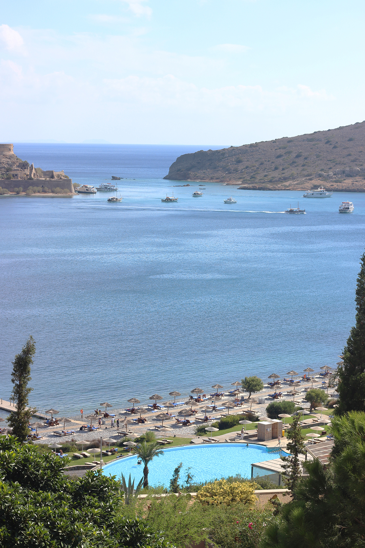 Luxury beach with swimming pool and views of islands in the distance