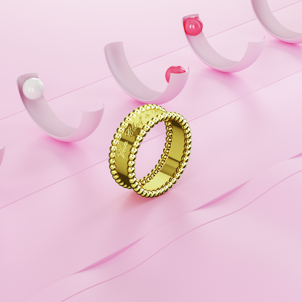 A gold ring on a pink surface with half pink circles in the background