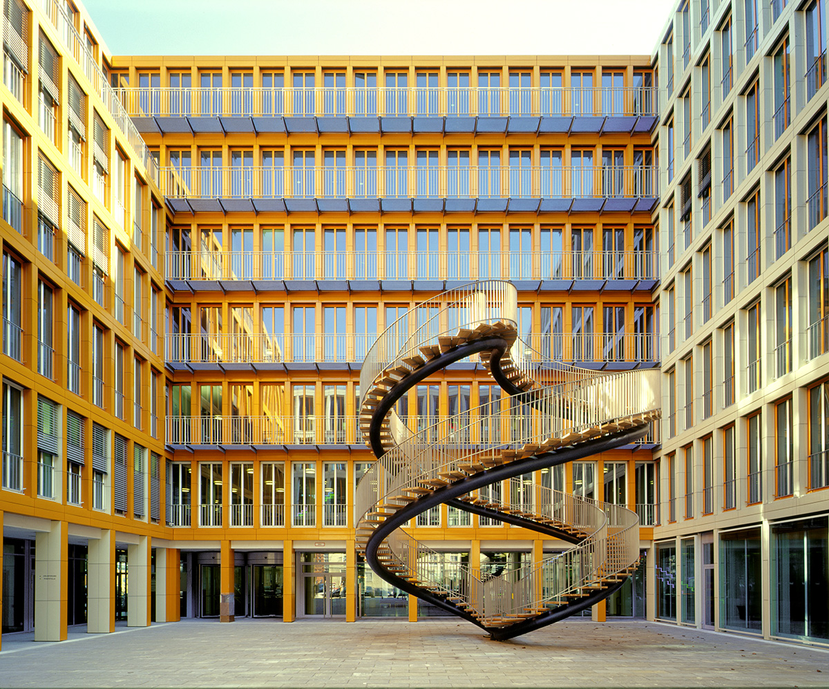 Curved stairway sculpture in the courtyard of buildings