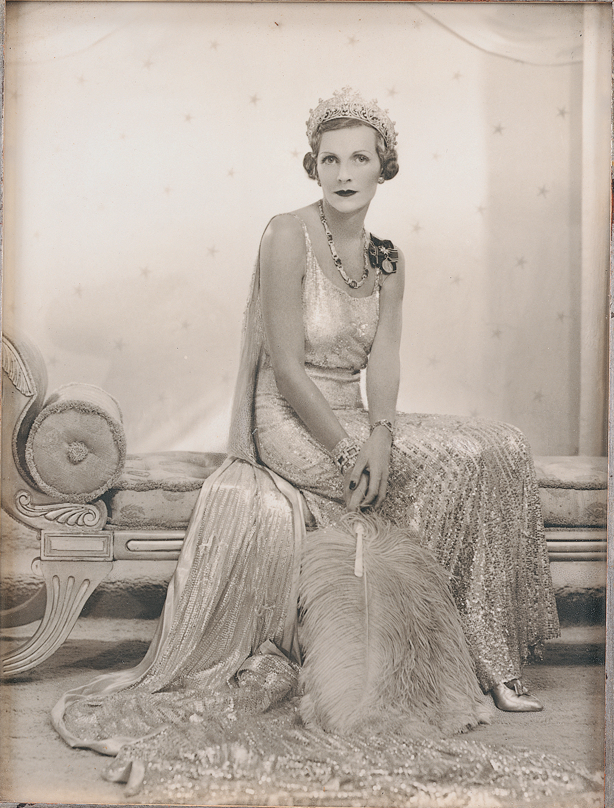 Antique photograph of a woman in evening dress wearing a tiara