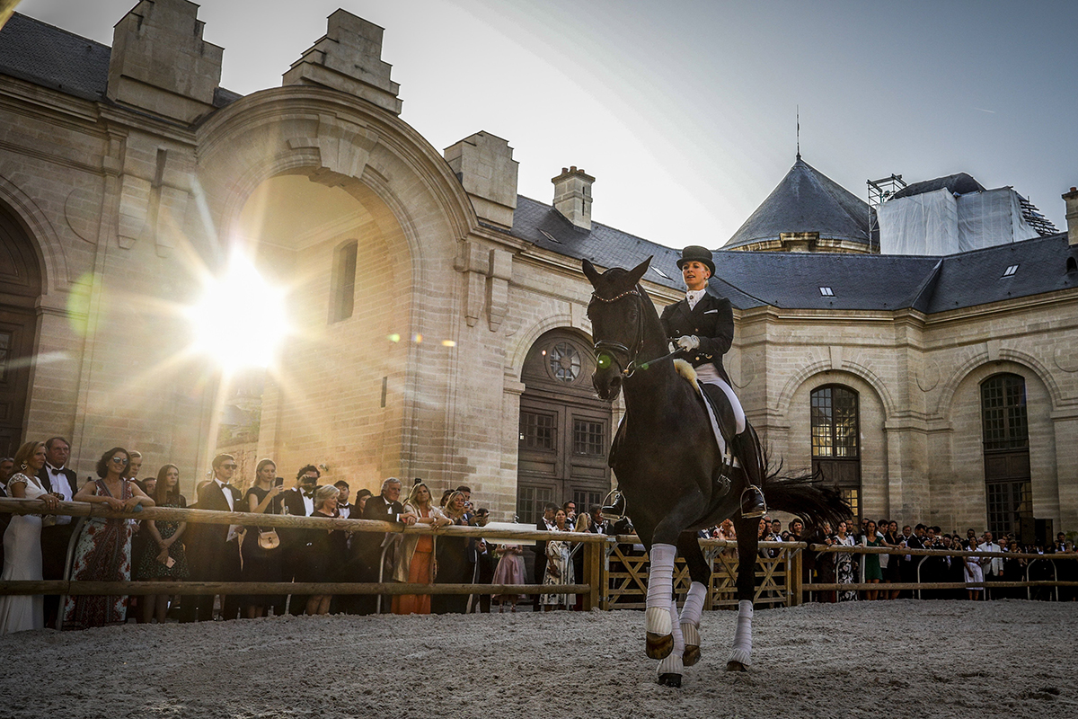 Horse rider performing in an arena of a stately home