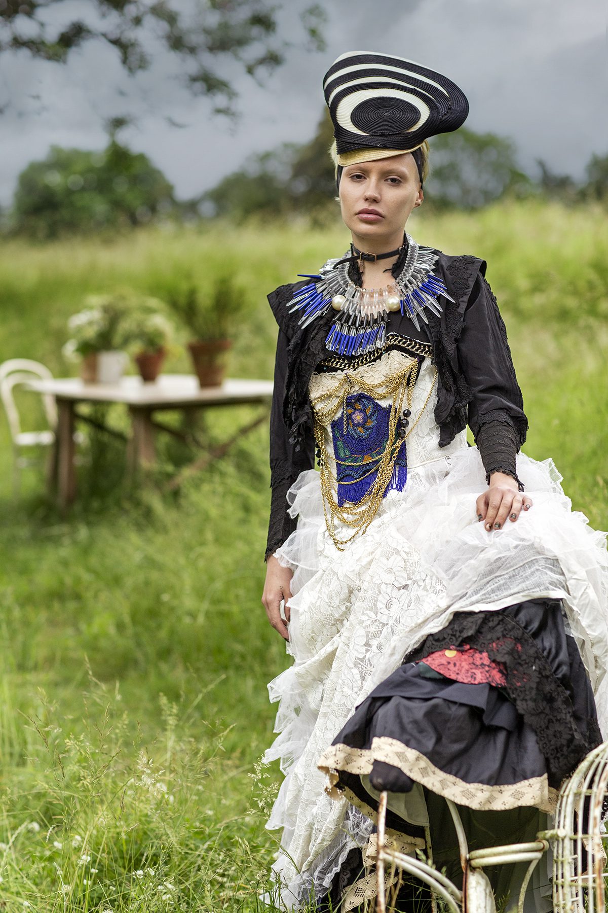 Model wearing a long dress walking through a field