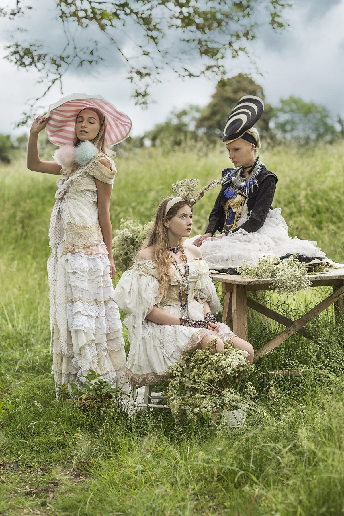 Three women posing in a field English countryside