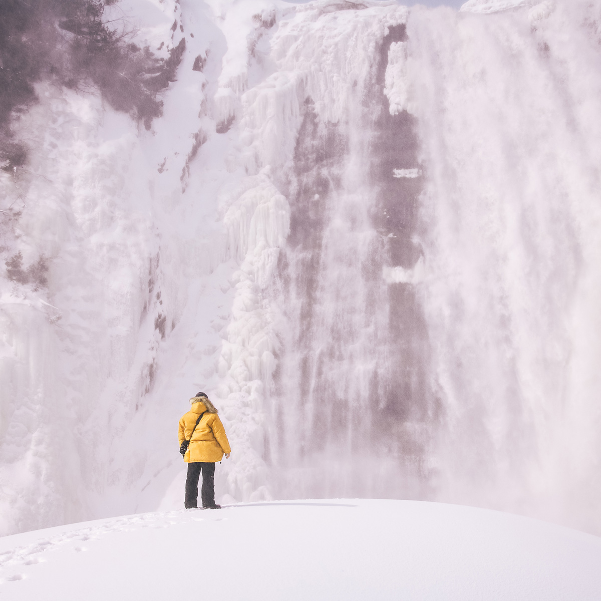 Man standing in front of an ice wall