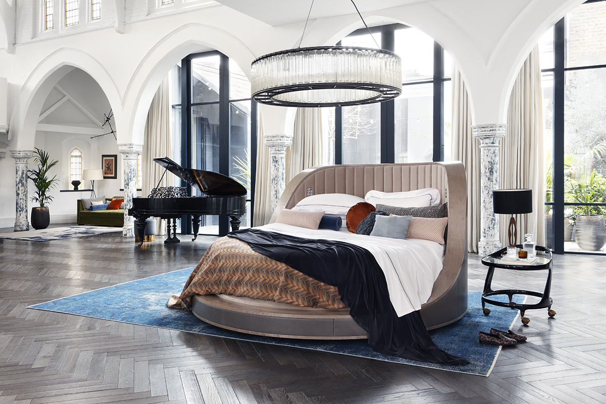 Luxurious circular bed in showroom setting