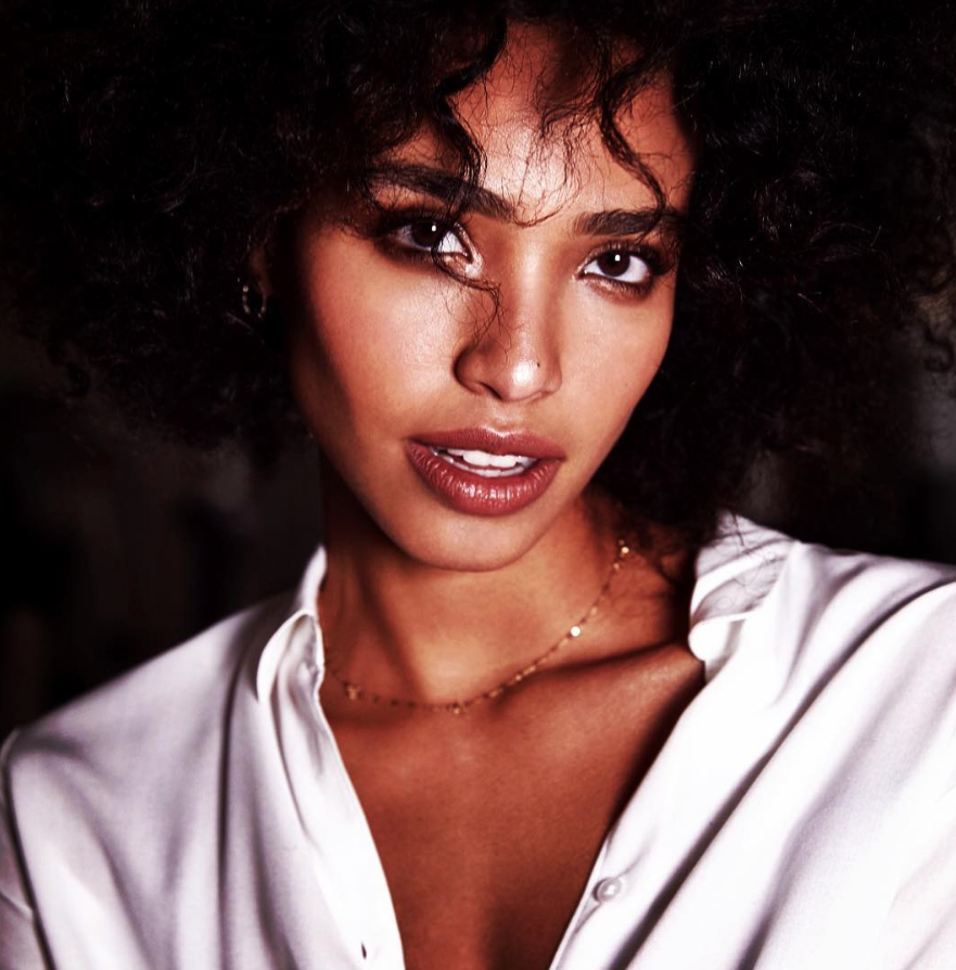 Portrait of a mixed race model wearing a white shirt