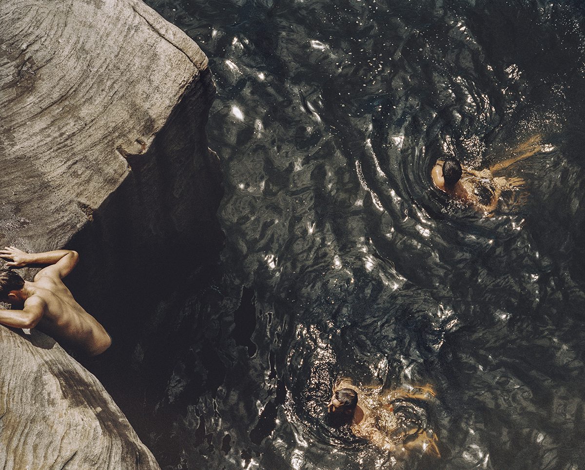 Bodies swimming in lake water