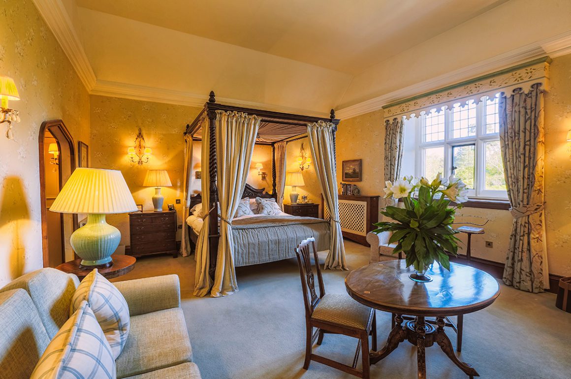 Luxurious hotel bedroom with four poster bed