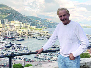 Man standing by yacht harbour