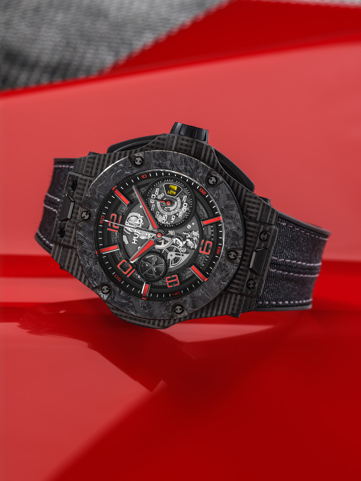 Black watch pictured on a red background