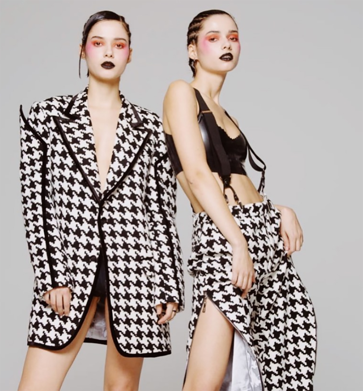 Two female twin models dressed in black and white