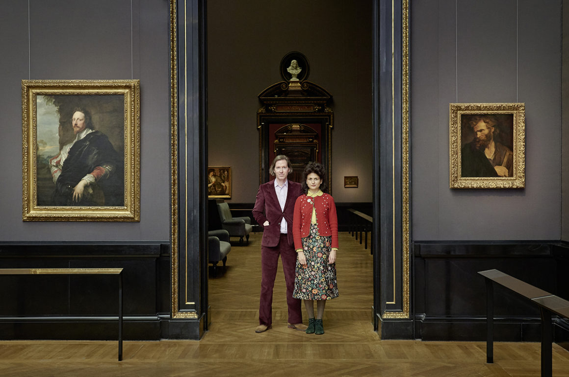 Man and woman standing in the doorway of a museum gallery space