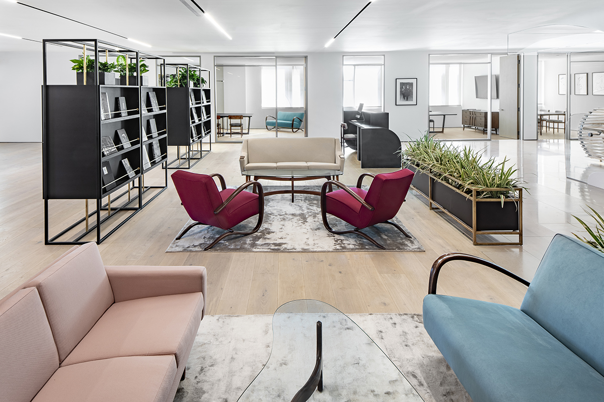 Contemporary luxury meeting space with sofas and plants