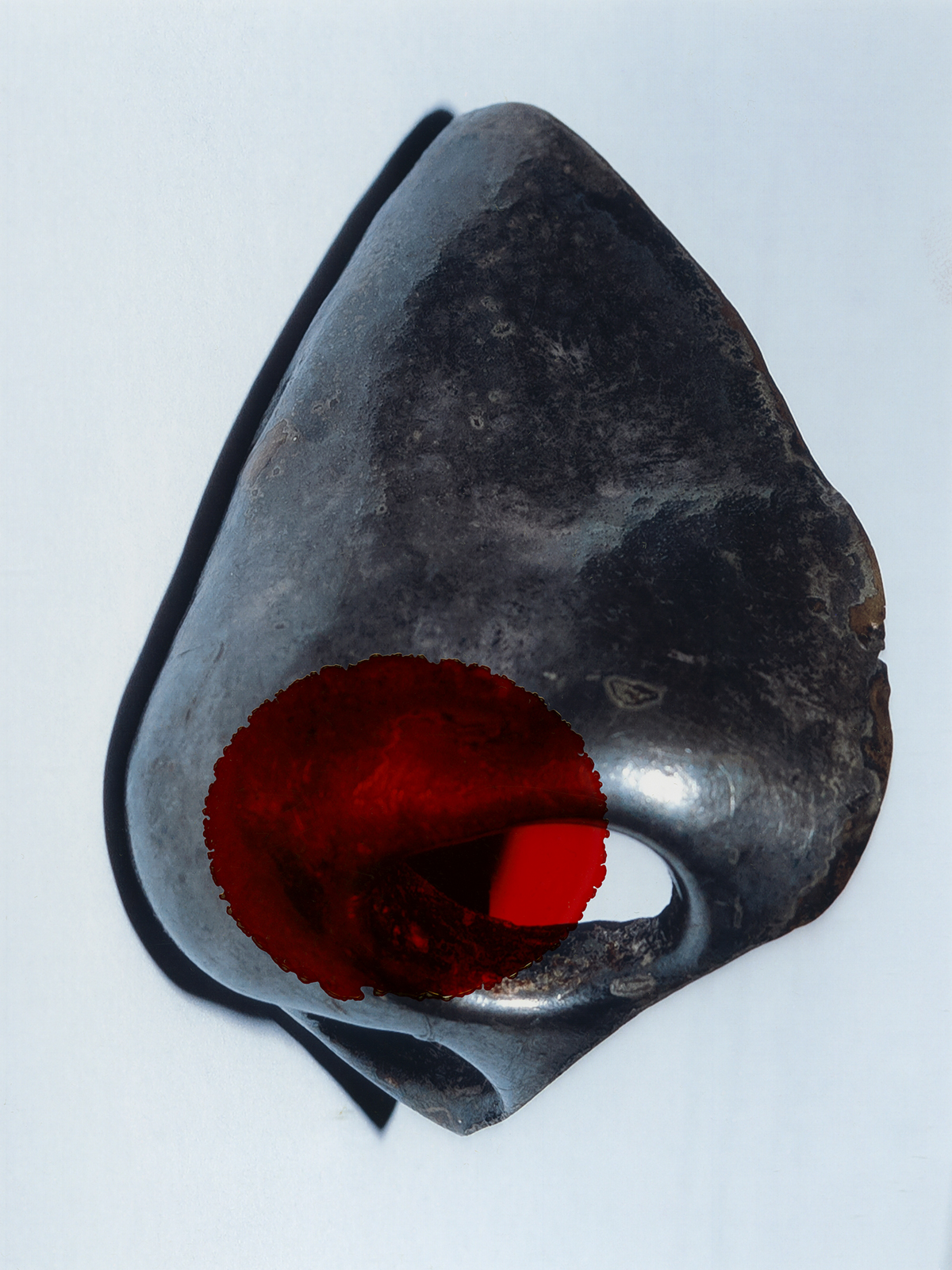 Abstract sculptural photograph with red circular graphic
