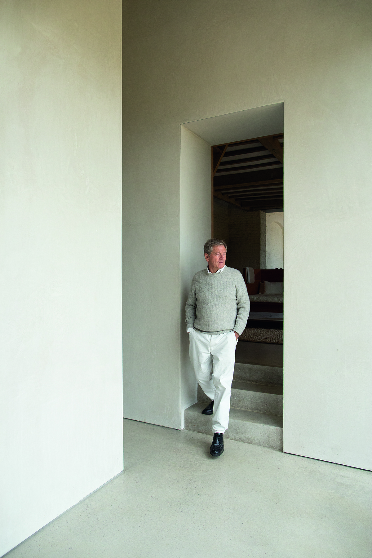 Man standing in doorway of staircase