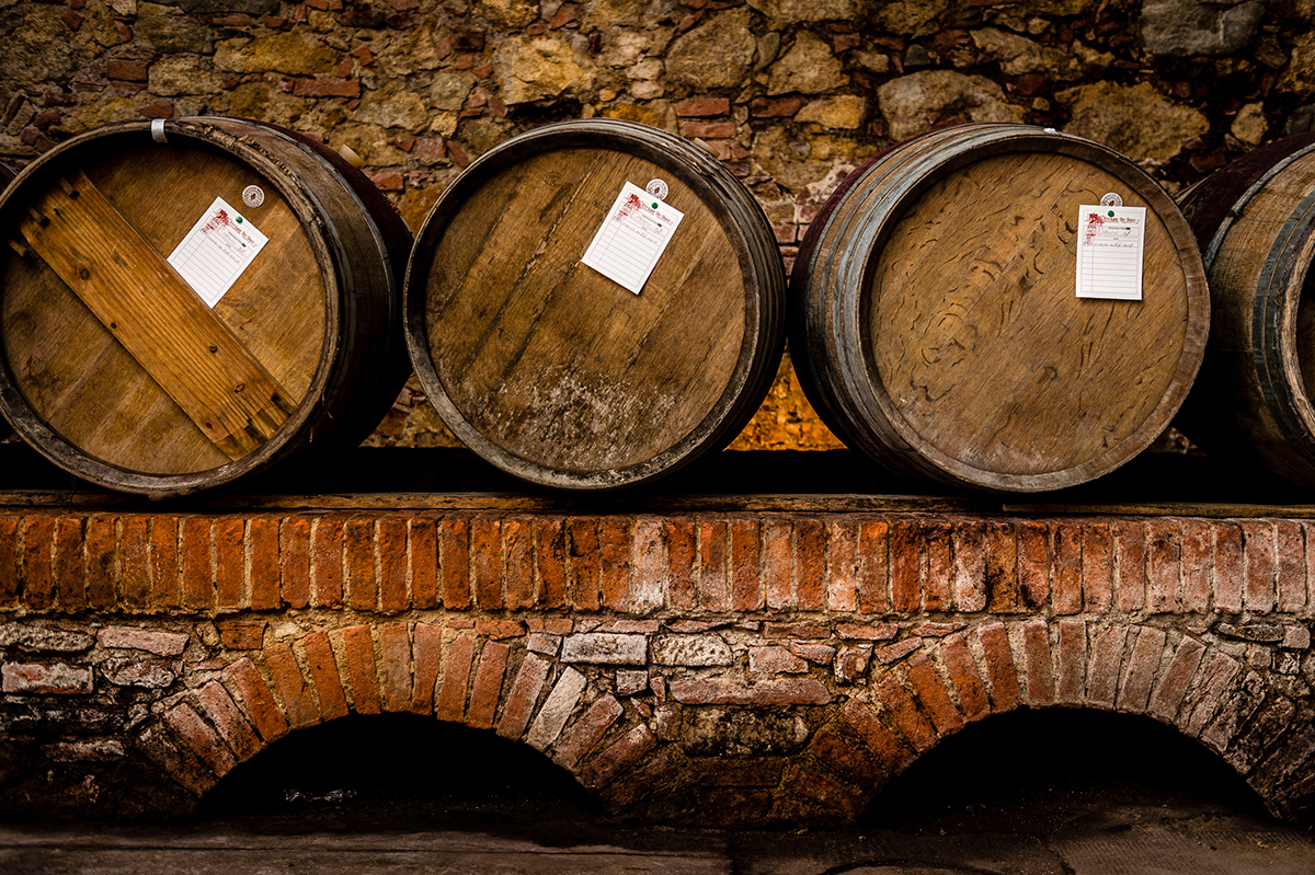 Wooden wine barrels in cellar