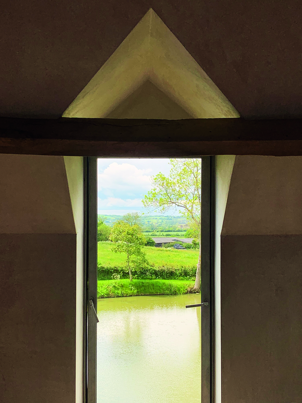 Window from a house onto a river