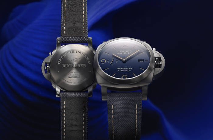 Luxury watch shown front and back against blue background