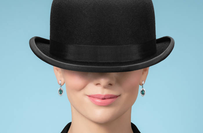 Woman wearing a bowling hat wearing jewellery