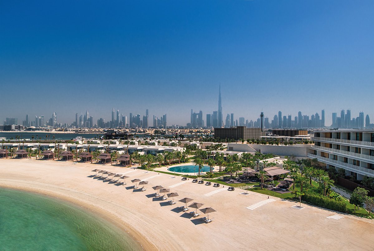 City beach landscape with skyscrapers in background