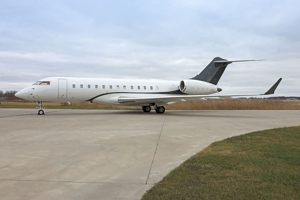 Exterior side of a private jet on the runway