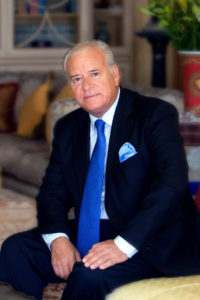 Business man sitting wearing blue suit and tie