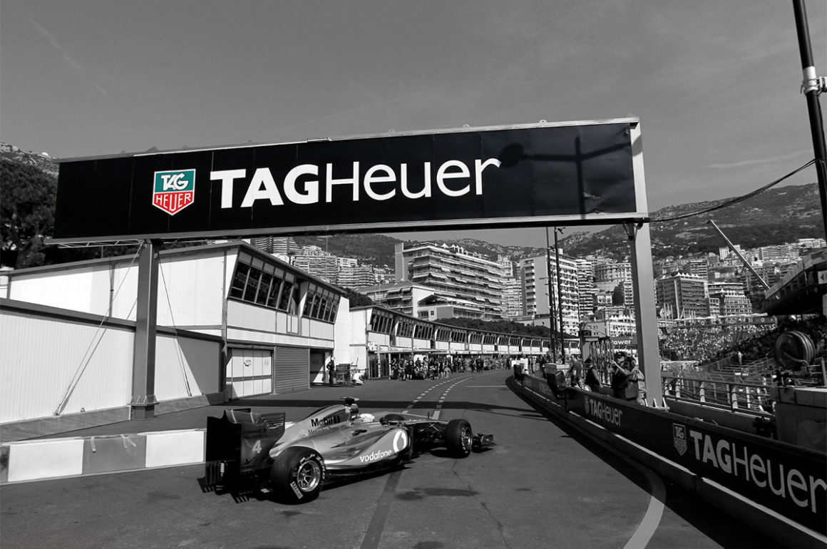 Vintage photograph of race track with Tag Heuer branding