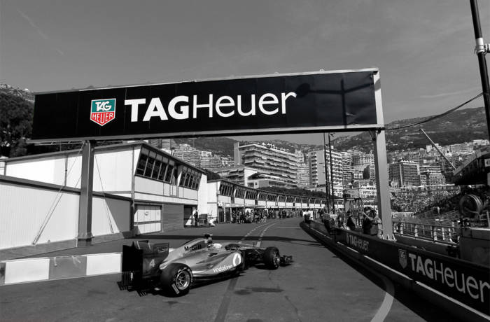 Vintage photograph of race track with Tag Heuer branding