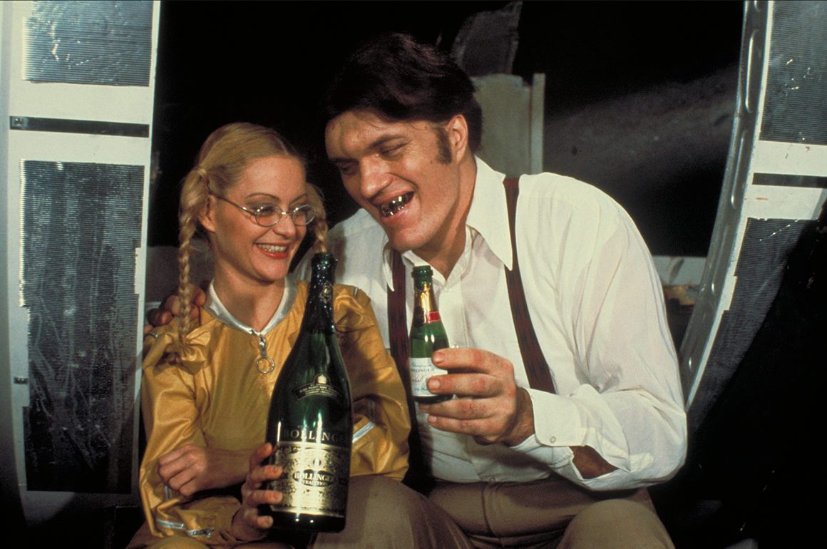 Cinematic still featuring a bottle of champagne