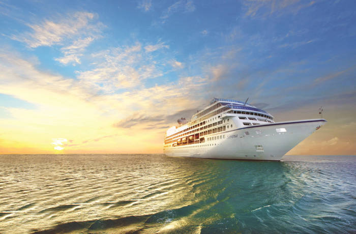 Luxury cruise ship on the ocean at sunset