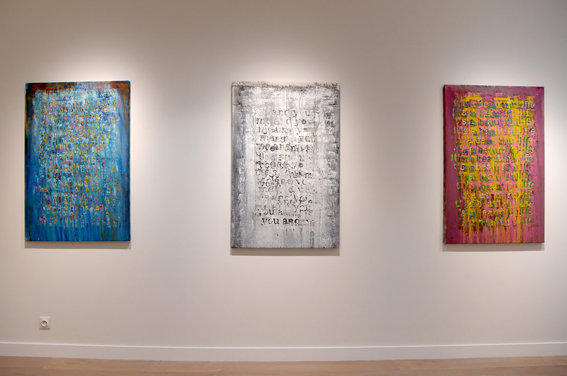 Installation view of three abstract paintings