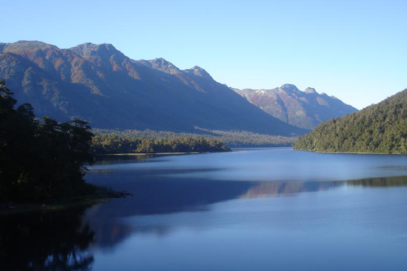 Large glacial lake surrounded by mountains