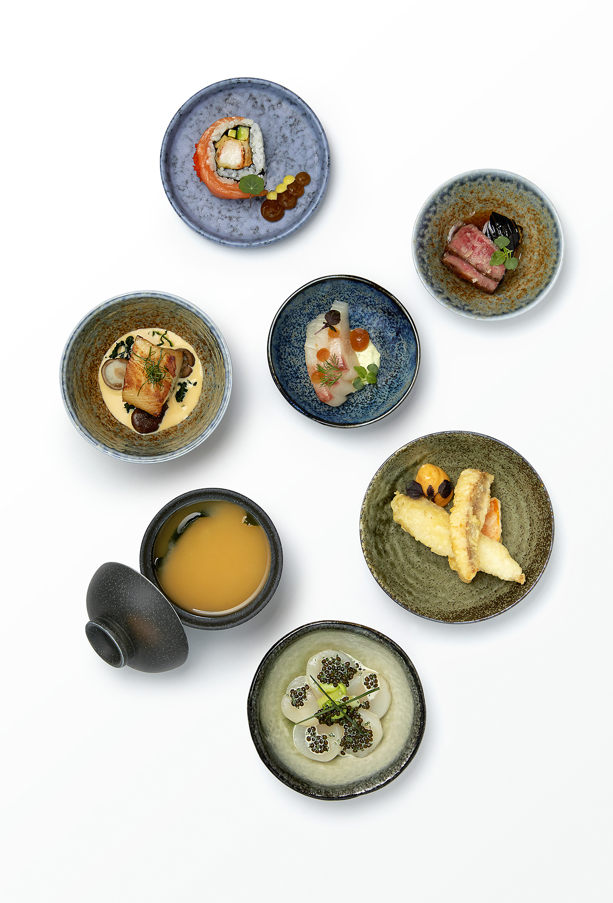 Plates of Japanese food laid on a table