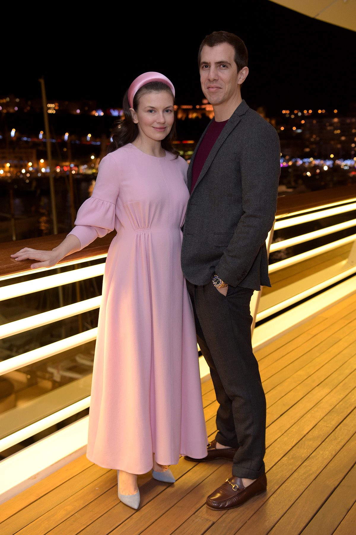 Man and woman stand on terrace 