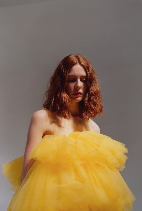 Model wearing puffy yellow tutu