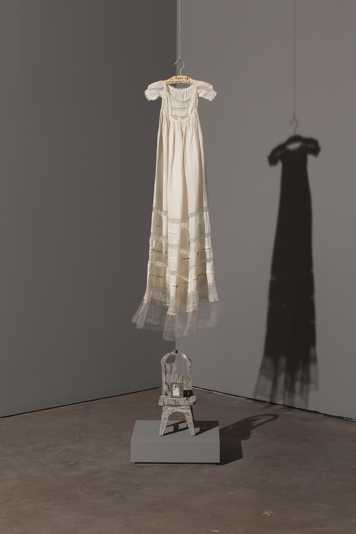 Dress hanging from the ceiling installation