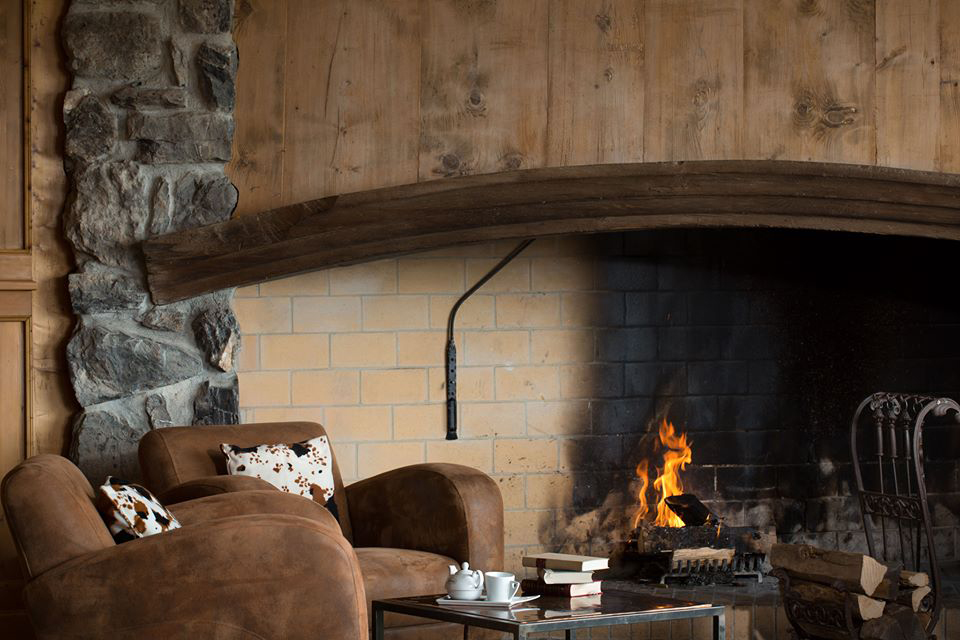 Alpine lounge area with armchair and fire
