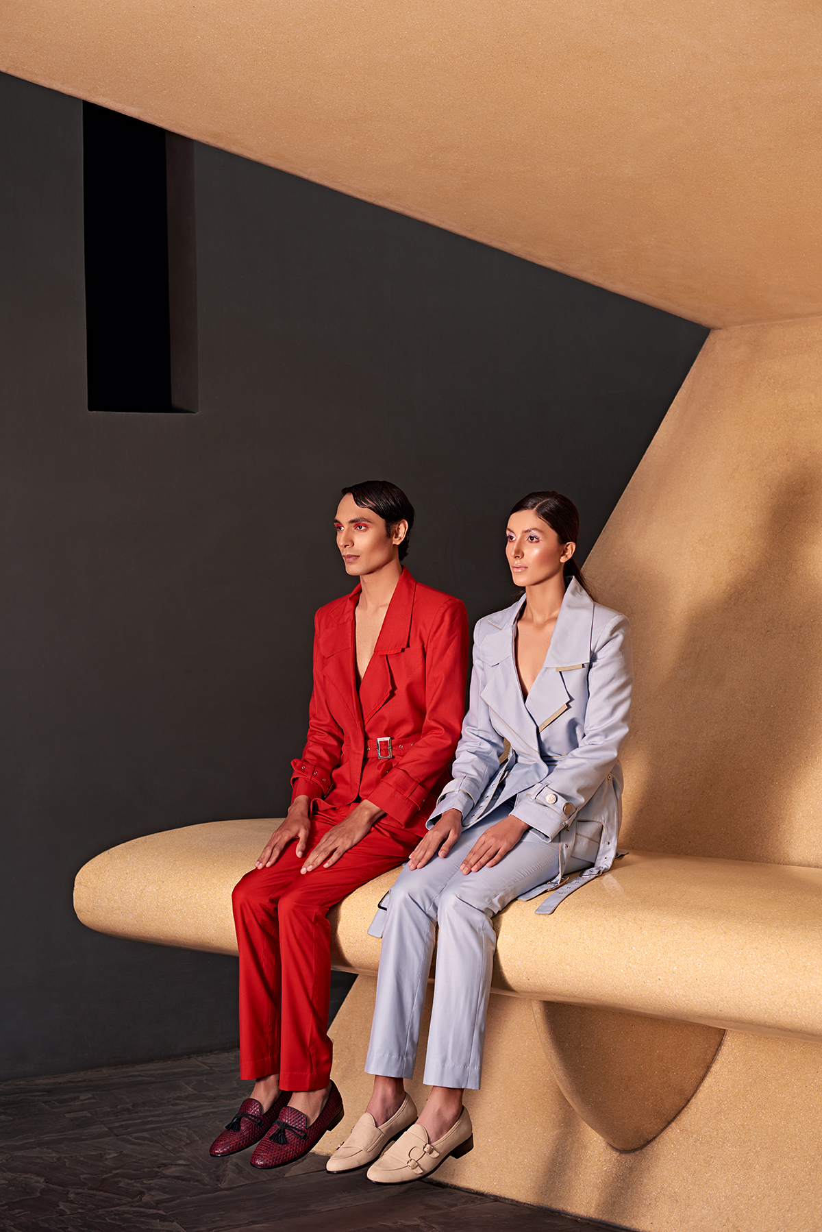 Two models sitting on a step