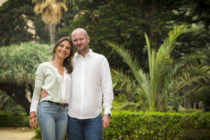 Man and woman standing in tropical garden