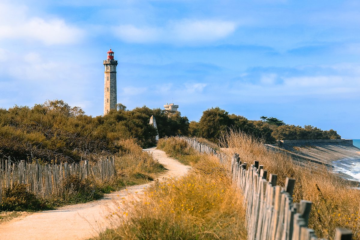 Lighthouse in countryside landscape