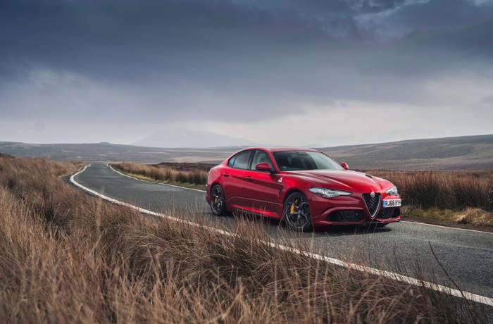 red sports car shown on the road