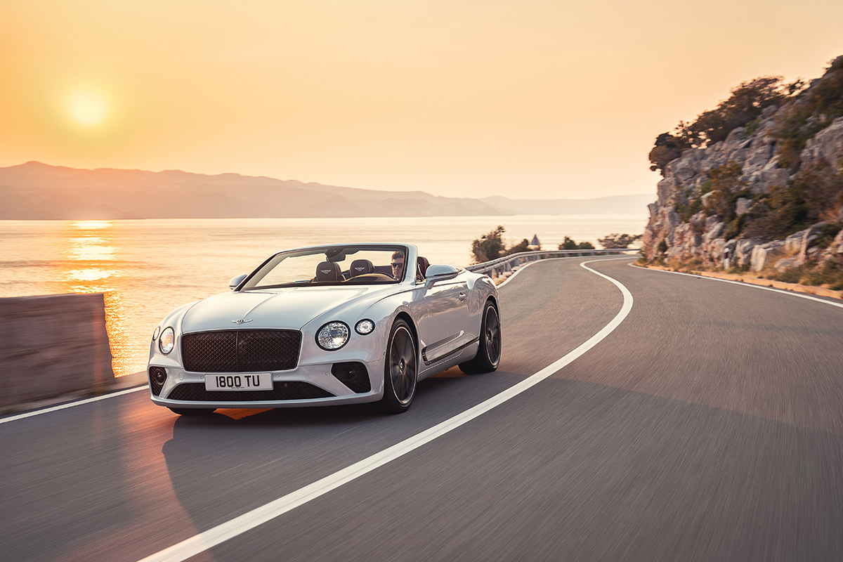 White convertible supercar on road