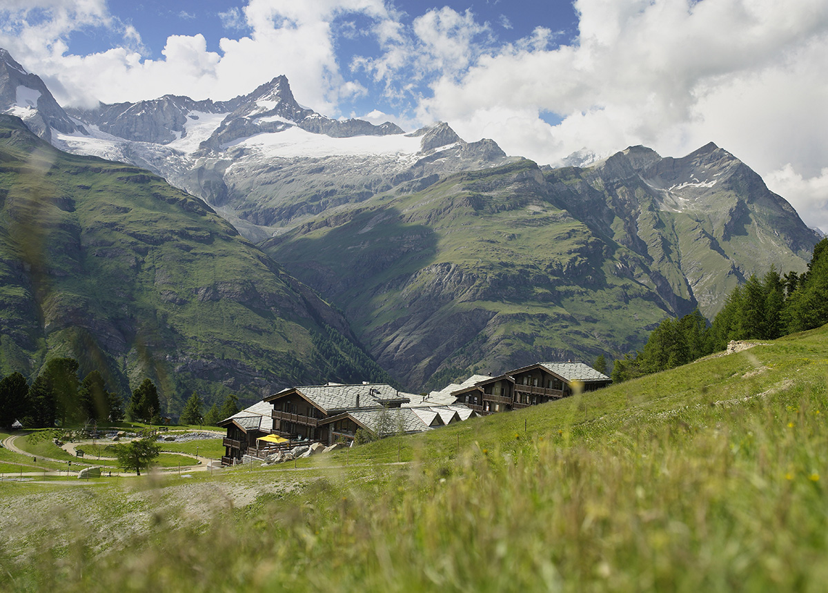 Alpine hotel nestled into mountainside