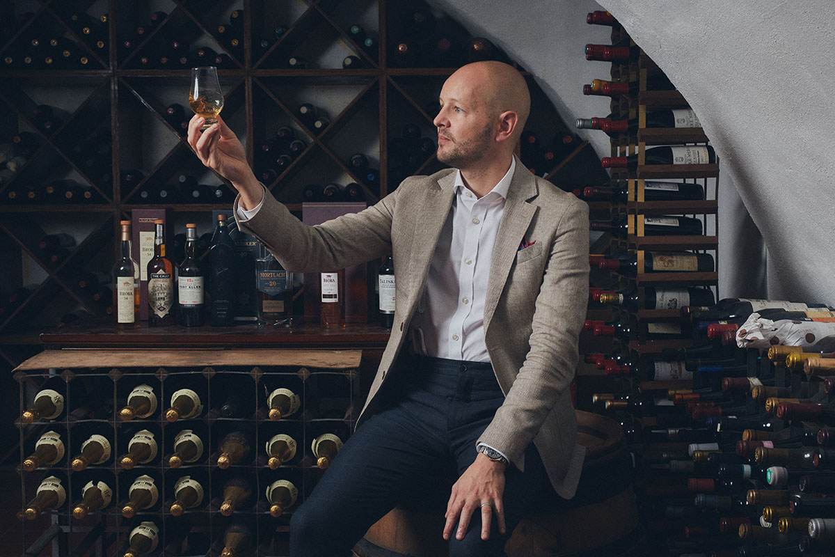 Man holding glass of whisky