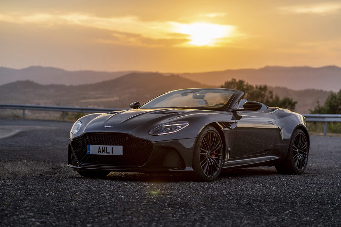 sports car on road at sunset