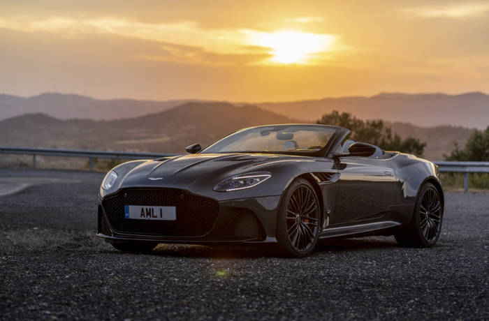 sports car on road at sunset