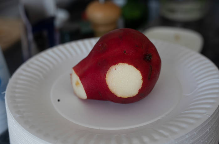 Pear with a slice cut out of its side