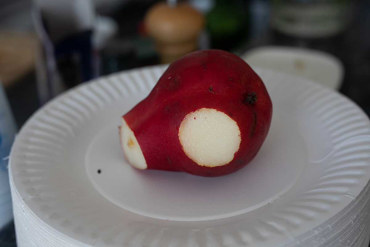 Pear with a slice cut out of its side